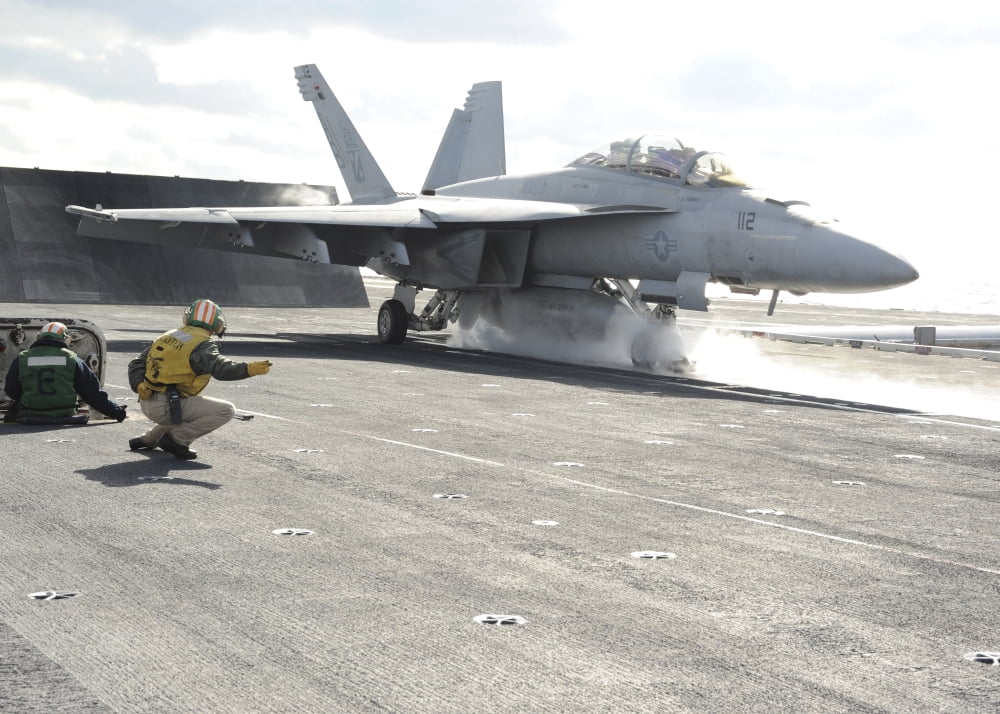 An FA-18F Super Hornet launches off the flight deck of USS Enterprise Canvas Art - Stocktrek Images (33 x 24)