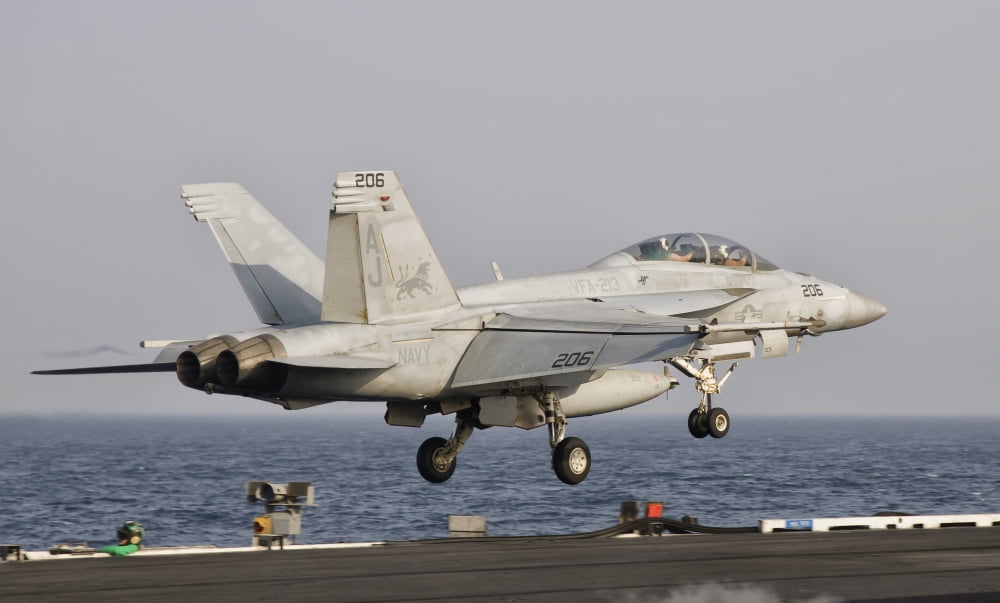 An FA-18F Super Hornet launches off the flight deck of USS George HW Bush Canvas Art - Giovanni CollaStocktrek Images (18 x 11)