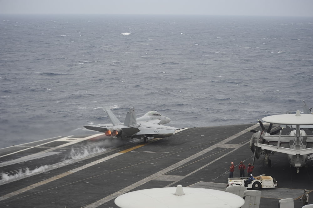 An FA-18F Super Hornet launches off the flight deck of USS Nimitz Canvas Art - Stocktrek Images (34 x 23)