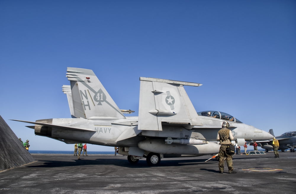 An FA-18F Super Hornet moves into launch position aboard aircraft carrier USS Nimitz Canvas Art - Giovanni CollaStocktrek Images (18 x 12)