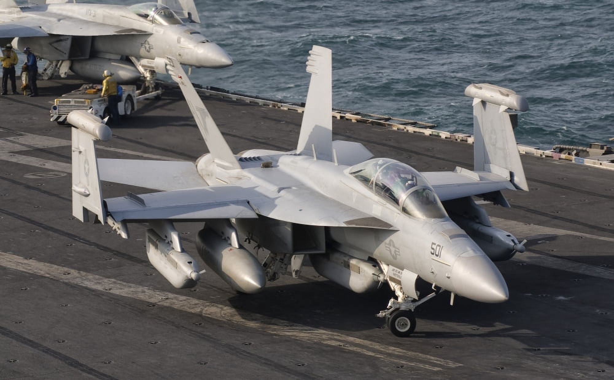 An FA-18F Super Hornet moving to the catapult aboard USS George HW Bush Canvas Art - Giovanni CollaStocktrek Images (36 x 23)