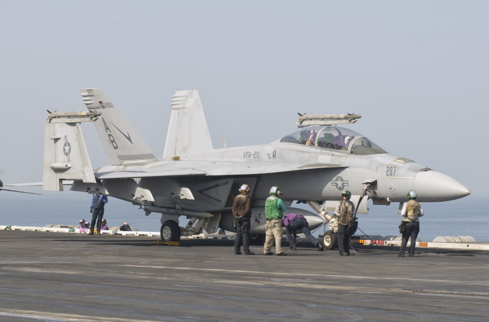 An FA-18F Super Hornet on the flight deck of USS Theodore Roosevelt Canvas Art - Giovanni CollaStocktrek Images (17 x 12)