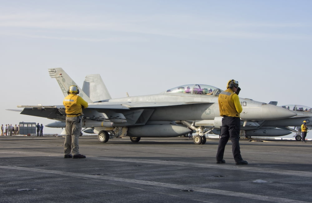 An FA-18F Super Hornet on the flight deck of USS Theodore Roosevelt Canvas Art - Giovanni CollaStocktrek Images (17 x 12)
