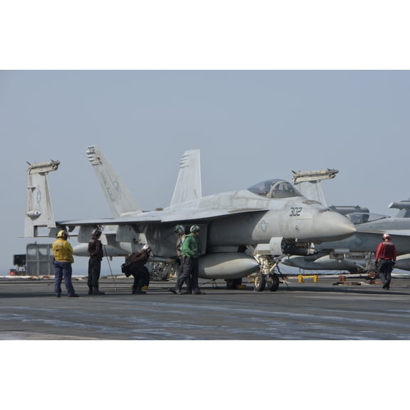 An FA-18F Super Hornet on the flight deck of USS Theodore Roosevelt Canvas Art - Giovanni CollaStocktrek Images (17 x 12)