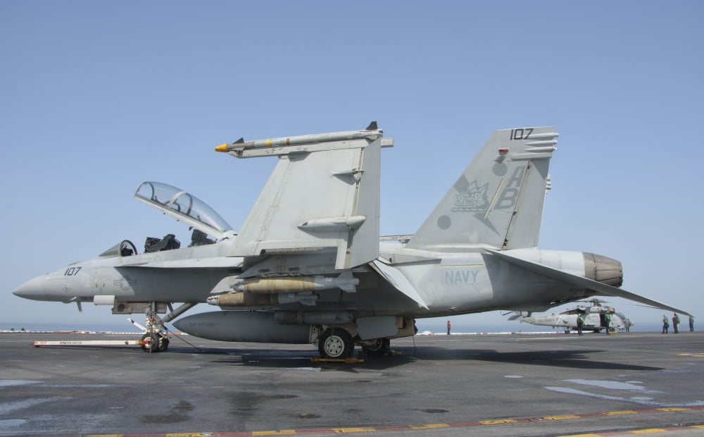 An FA-18F Super Hornet on the flight deck of USS Theodore Roosevelt Canvas Art - Giovanni CollaStocktrek Images (18 x 11)