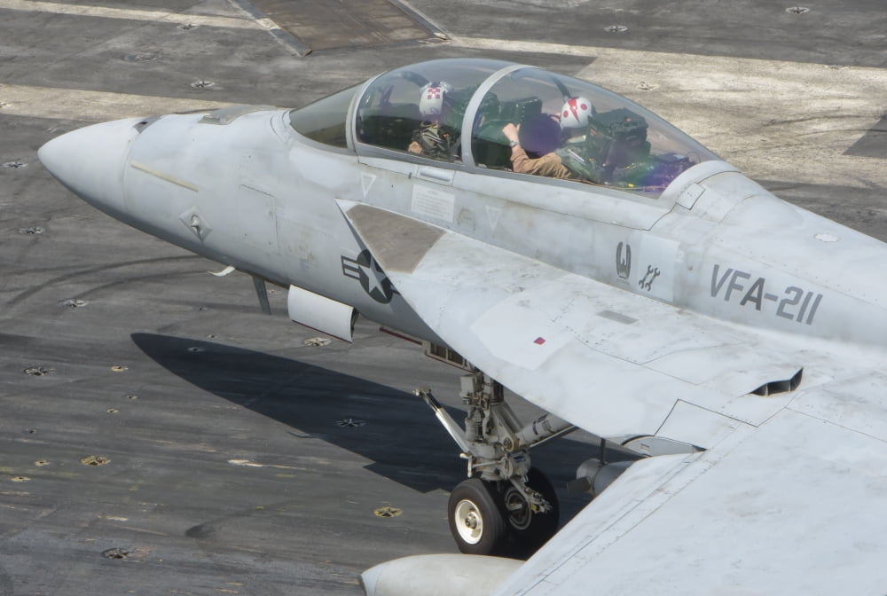 An FA-18F Super Hornet on the flight deck of USS Theodore Roosevelt Canvas Art - Giovanni CollaStocktrek Images (34 x 23)