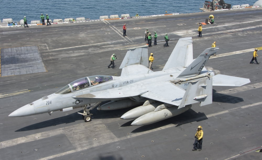 An FA-18F Super Hornet on the flight deck of USS Theodore Roosevelt Canvas Art - Giovanni CollaStocktrek Images (36 x 22)