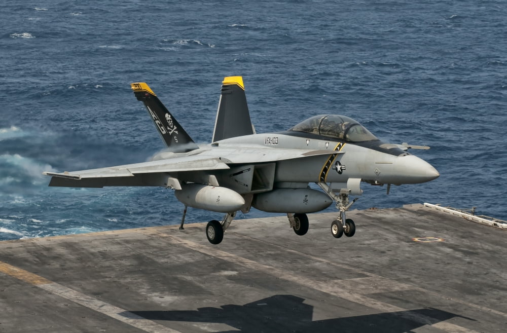 An FA-18F Super Hornet prepares to land aboard USS Eisenhower Canvas Art - Giovanni CollaStocktrek Images (18 x 12)