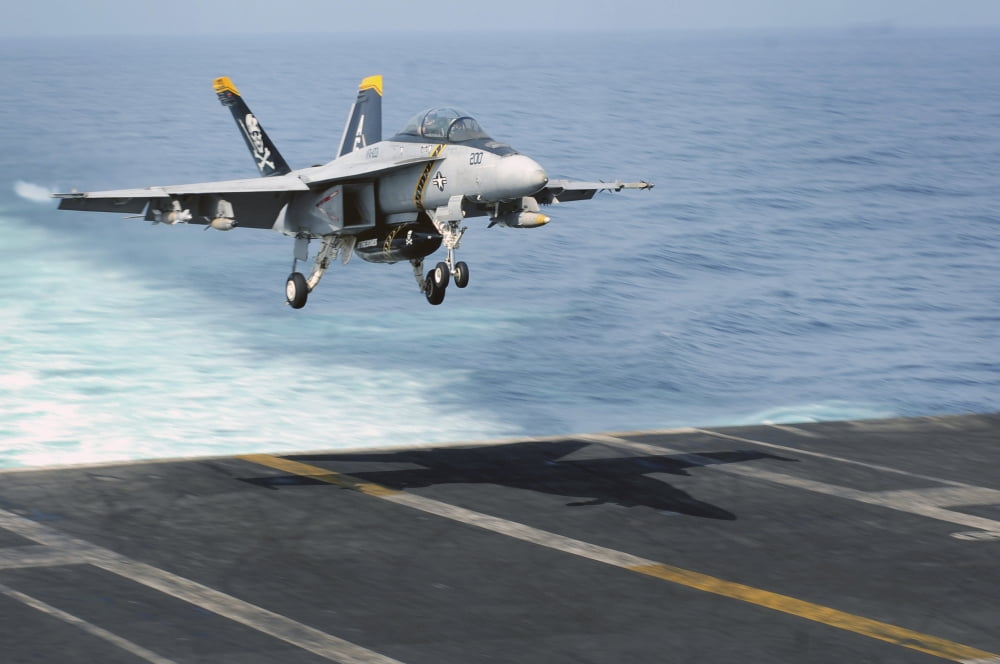 An FA-18F Super Hornet prepares to land on the flight deck USS Dwight D Eisenhower Canvas Art - Stocktrek Images (35 x 23)