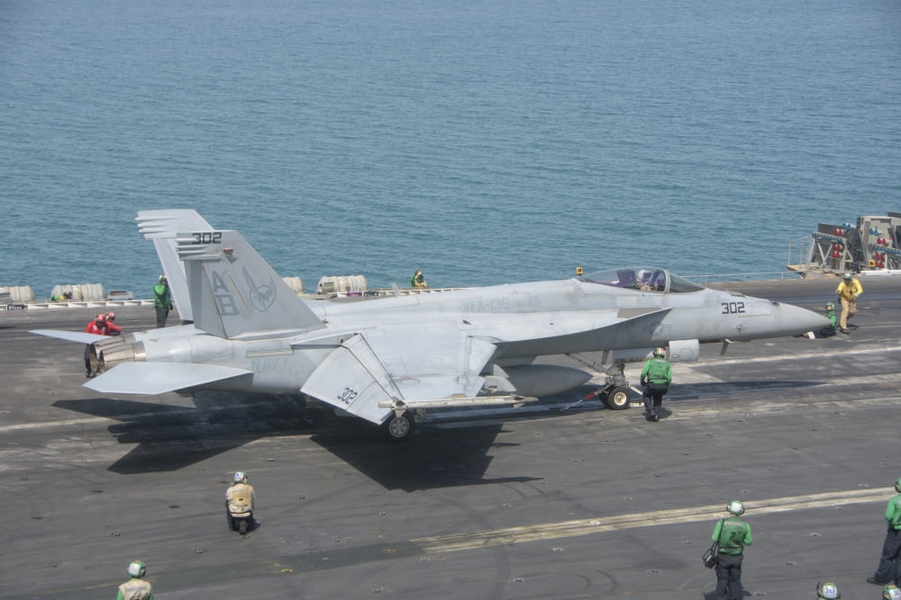 An FA-18F Super Hornet ready to launch from a catapult aboard USS Theodore Roosevelt Canvas Art - Giovanni CollaStocktrek Images (17 x 12)