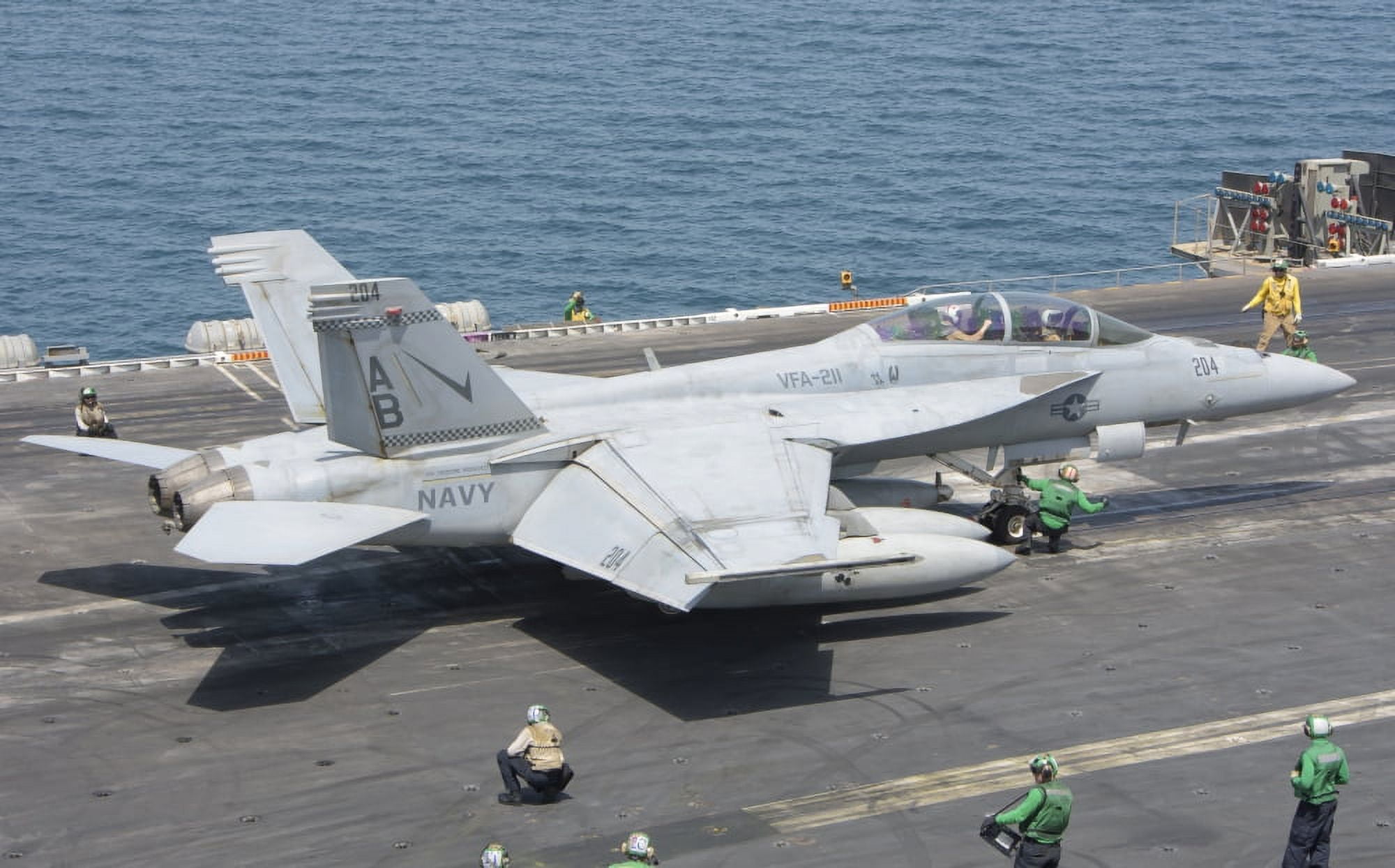 An FA-18F Super Hornet ready to launch from a catapult aboard USS Theodore Roosevelt Canvas Art - Giovanni CollaStocktrek Images (35 x 22)