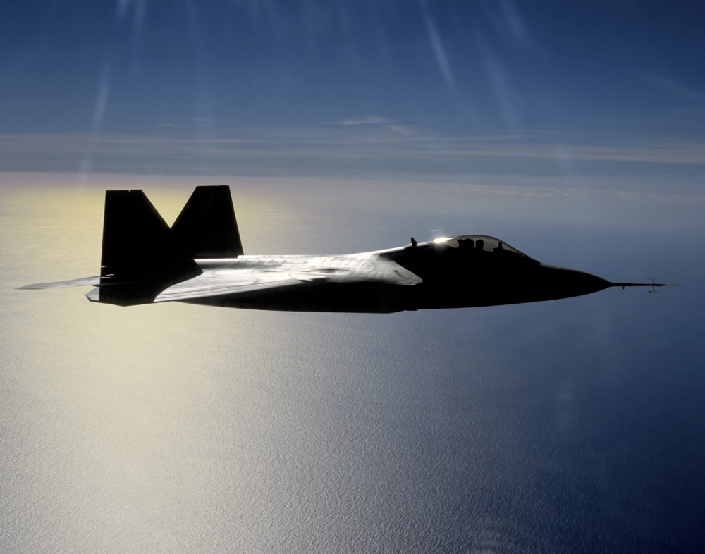 An FA-22 Raptor flies a training mission Canvas Art - Stocktrek Images (31 x 25)