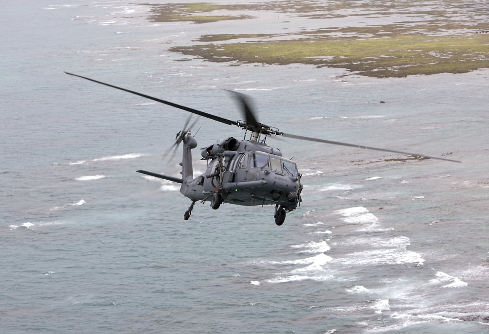 An HH-60G Pave Hawk flies along the coastline of Okinawa Japan Canvas Art - HIGH-G ProductionsStocktrek Images (18 x 12)