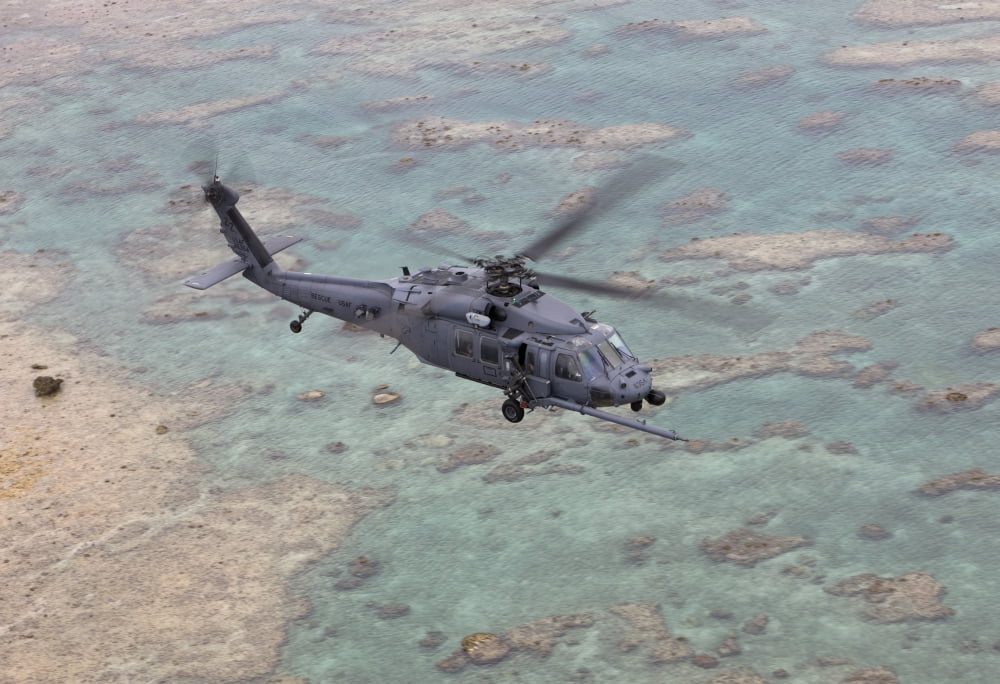 An HH-60G Pave Hawk flies along the coastline of Okinawa Japan Canvas Art - HIGH-G ProductionsStocktrek Images (35 x 24)