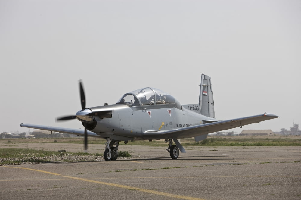 An Iraqi Air Force T-6 Texan trainer aircraft taxis out for a flight over Tikrit Iraq Canvas Art - Terry MooreStocktrek Images (18 x 12)