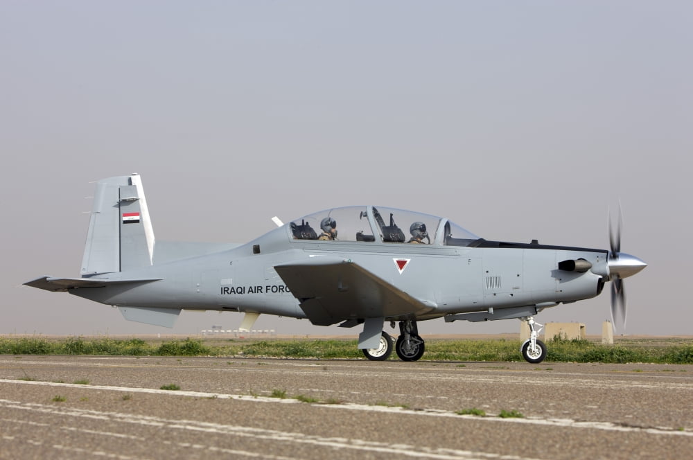 An Iraqi Air Force T-6 Texan trainer aircraft taxis out for a flight over Tikrit Iraq Canvas Art - Terry MooreStocktrek Images (35 x 23)