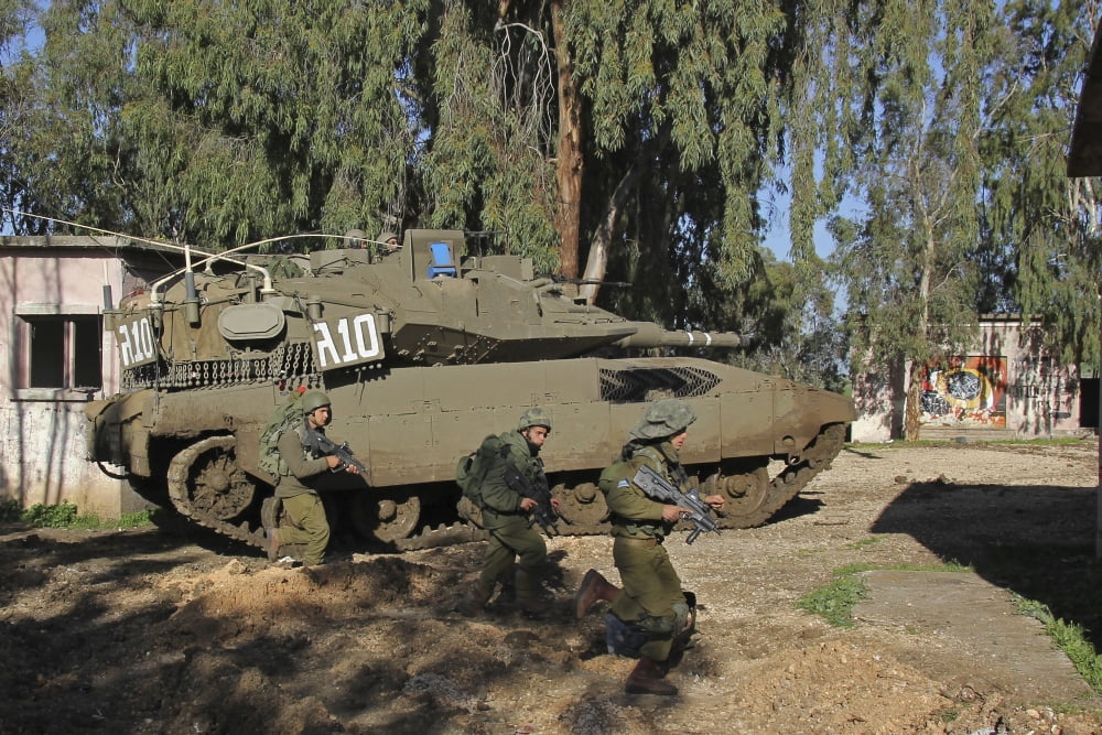 An Israel Defense Force Merkava Mark II battle tank with infantry forces Canvas Art - Ofer ZidonStocktrek Images (35 x 23)