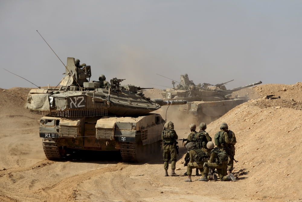 An Israel Defense Force Merkava Mark IV battle tank with infantry forces Canvas Art - Ofer ZidonStocktrek Images (18 x 12)