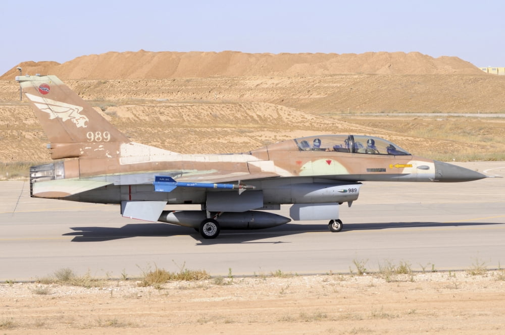 An Israeli Air Force F-16B Netz taxiing at Nevatim Airbase Canvas Art - Riccardo NiccoliStocktrek Images (34 x 23)
