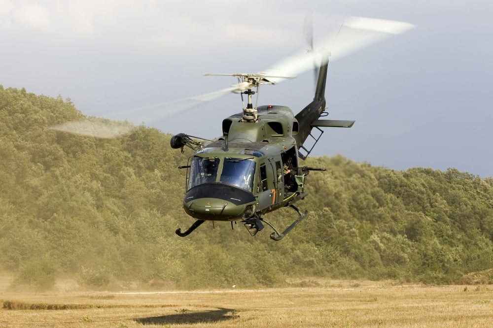 An Italian Air Force AB-212 ICO helicopter departs the landing zone Italy Canvas Art - Erik RoelofsStocktrek Images (18 x 12)
