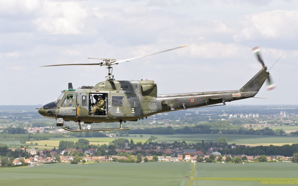 An Italian Air Force AB-212 ICO helicopter over France Canvas Art - Giovanni CollaStocktrek Images (36 x 22)