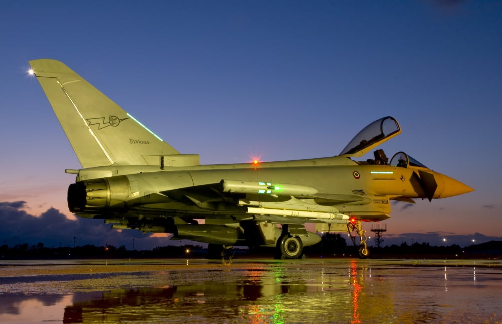 An Italian Air Force Eurofighter Typhoon at night on Decimomannu Air Base Italy Canvas Art - Giovanni CollaStocktrek Images (18 x 12)