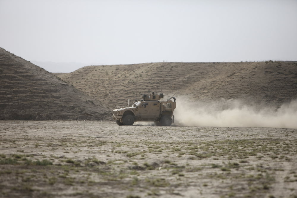 An M-ATV races across the wadi near Kunduz Afghanistan Canvas Art - Terry MooreStocktrek Images (35 x 24)