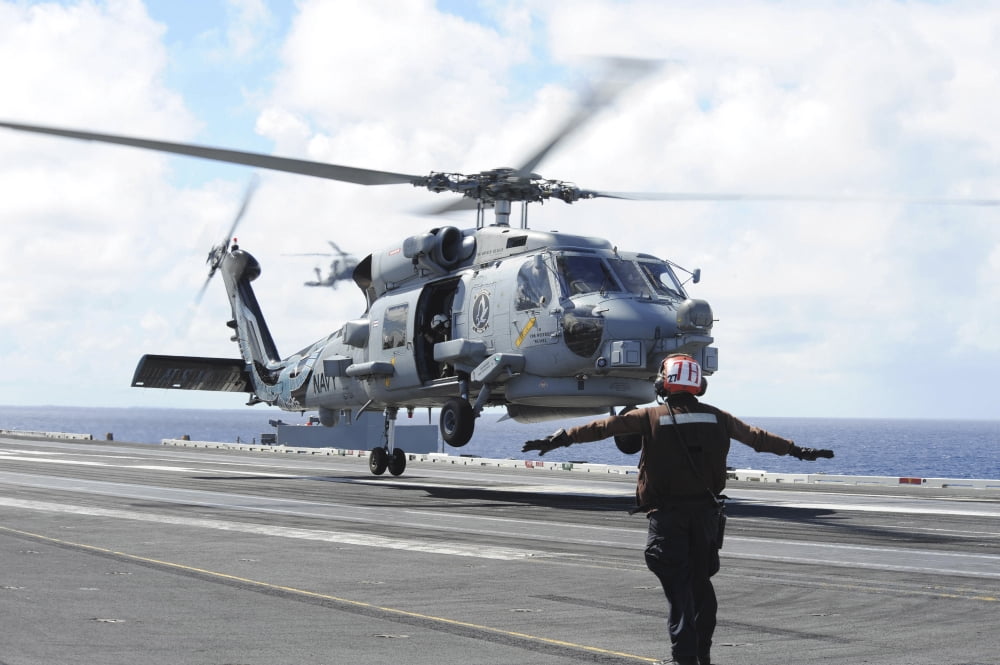 An MH-60R Sea Hawk lifts off the flight deck of USS Ronald Reagan Canvas Art - Stocktrek Images (34 x 23)