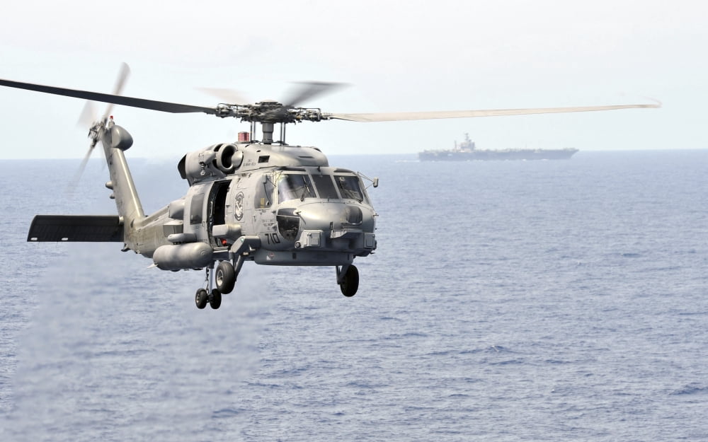 An MH-60R Seahawk helicopter in flight over the Pacific Ocean Canvas Art - Stocktrek Images (36 x 22)