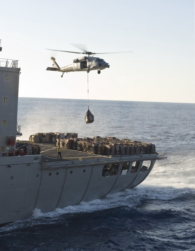 An MH-60S Sea Hawk helicopter carries supplies Canvas Art - Stocktrek Images (25 x 32)