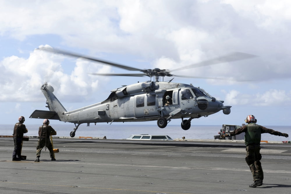 An MH-60S Sea Hawk lands on the flight deck of USS John C Stennis Canvas Art - Stocktrek Images (35 x 23)