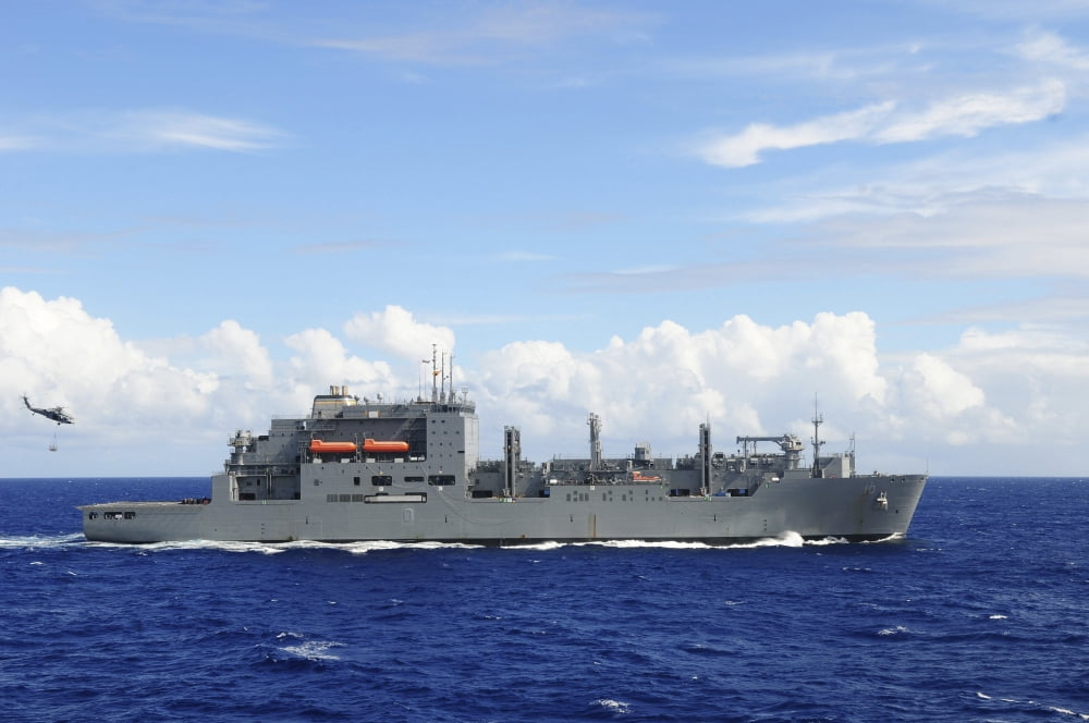 An MH-60S Sea Hawk prepares to drop a pallet of supplies onto USNS Charles Drew Canvas Art - Stocktrek Images (35 x 24)