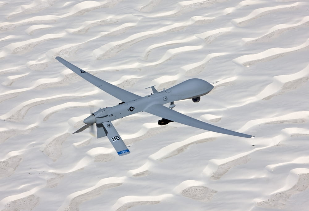 An MQ-1 Predator flies over the White Sands National Monument New Mexico Canvas Art - HIGH-G ProductionsStocktrek Images (18 x 12)