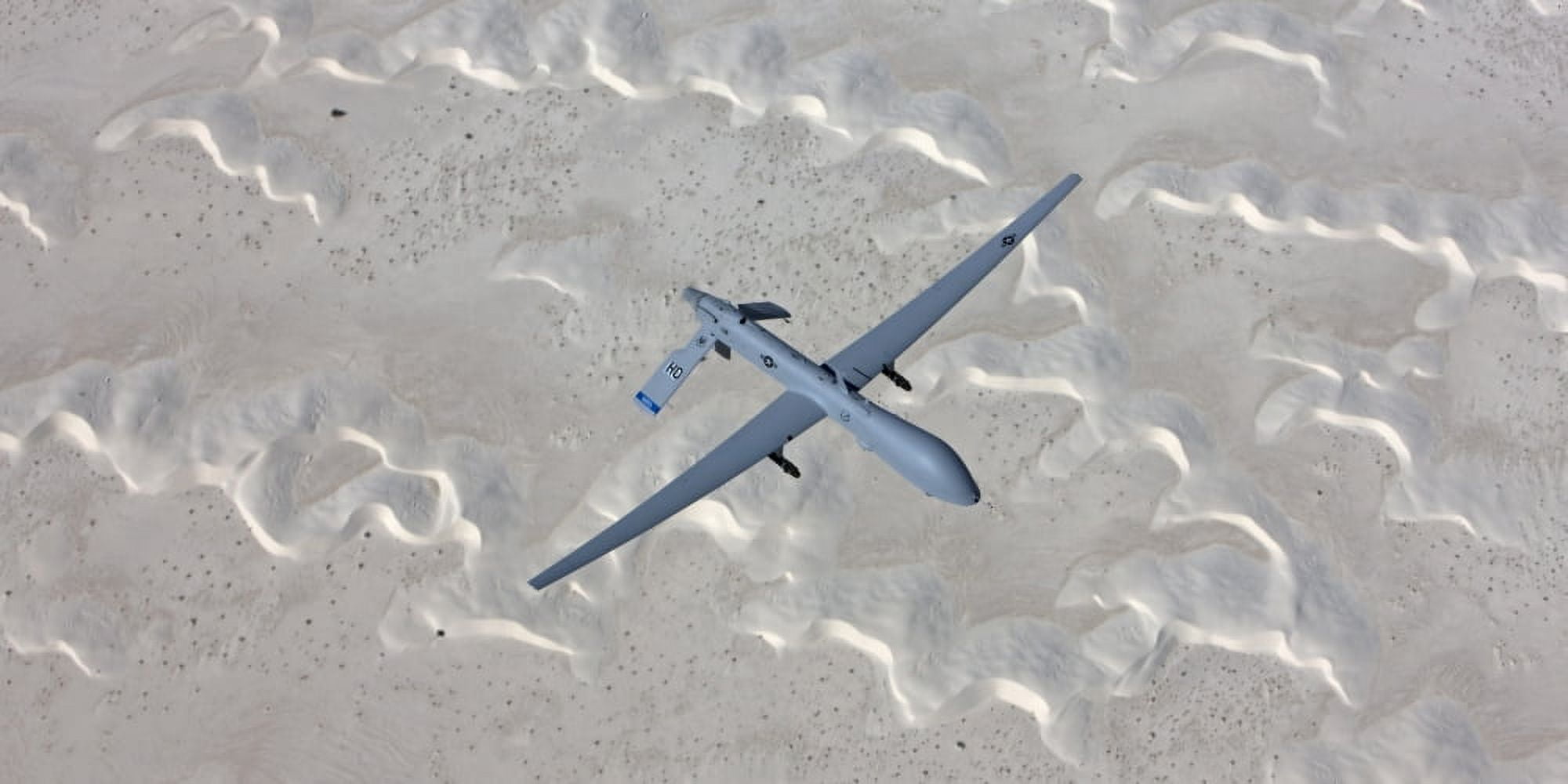 An MQ-1 Predator flies over the White Sands National Monument New Mexico Canvas Art - HIGH-G ProductionsStocktrek Images (20 x 10)