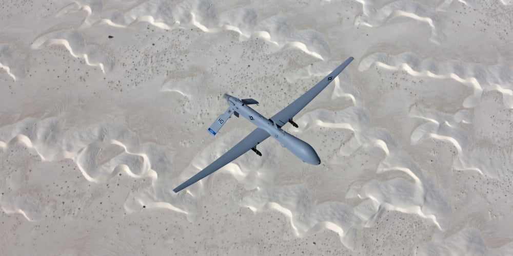 An MQ-1 Predator flies over the White Sands National Monument New Mexico Canvas Art - HIGH-G ProductionsStocktrek Images (40 x 20)
