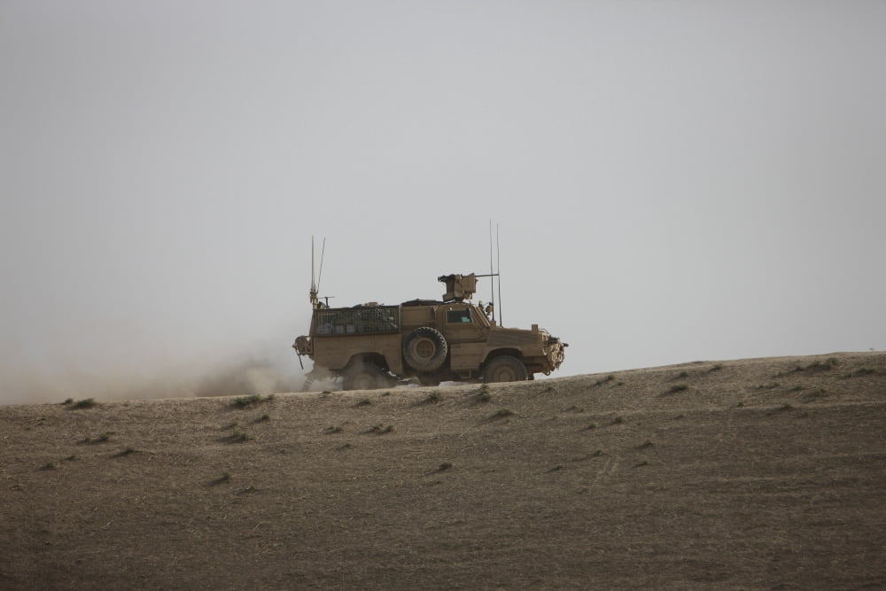 An MRAP vehicle patrols the ridge of a wadi near Kunduz Afghnanistan Canvas Art - Terry MooreStocktrek Images (18 x 12)