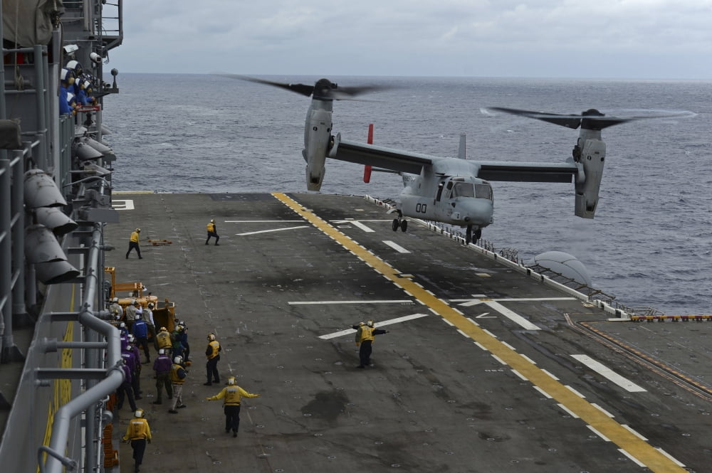 An MV-22 Osprey tiltrotor aircraft prepares to land on the flight deck Canvas Art - Stocktrek Images (34 x 23)