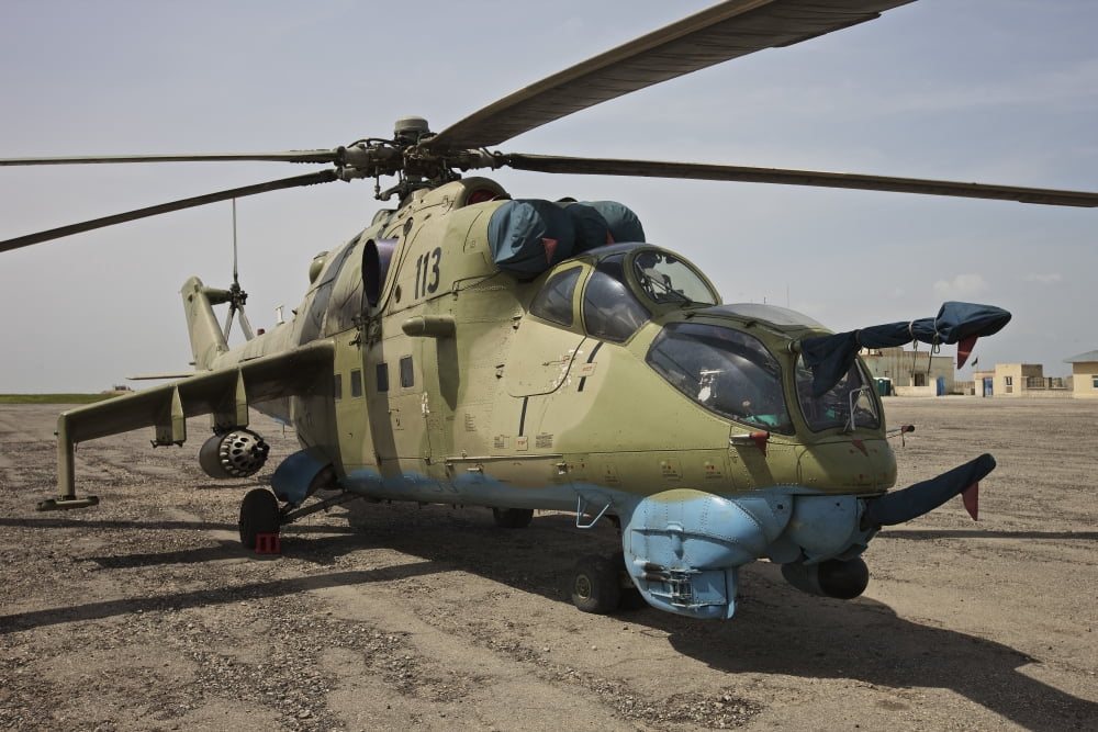 An Mi-35 attack helicopter at Kunduz Airfield Afghanistan Canvas Art - Terry MooreStocktrek Images (18 x 12)