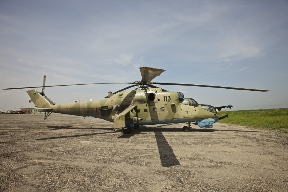 An Mi-35 attack helicopter at Kunduz Airfield Afghanistan Canvas Art - Terry MooreStocktrek Images (35 x 24)