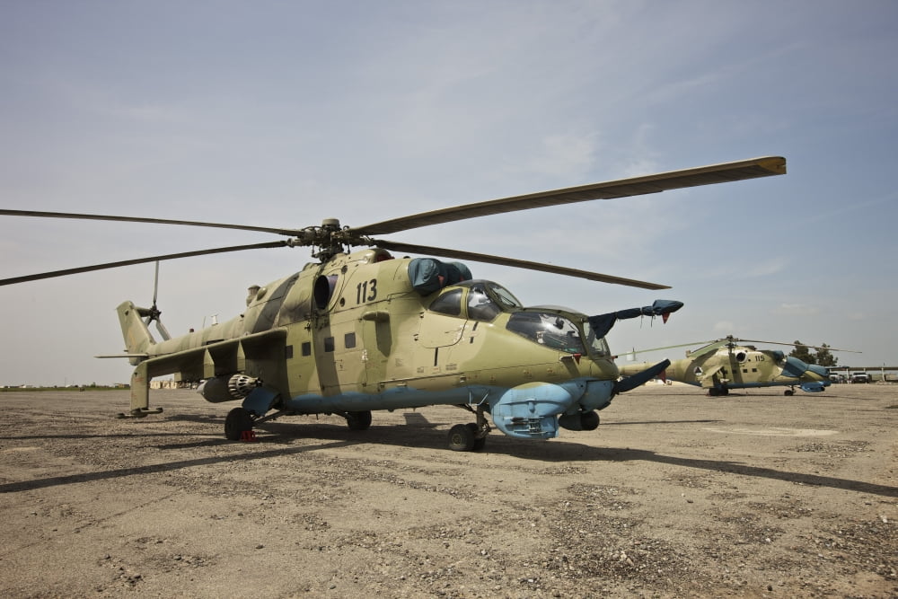 An Mi-35 attack helicopter at Kunduz Airfield Afghanistan Canvas Art - Terry MooreStocktrek Images (35 x 24)