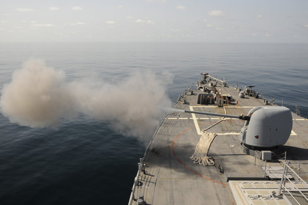An Mk-45 lightweight gun is fired aboard guided missile destroyer USS Mitscher Canvas Art - Stocktrek Images (35 x 23)