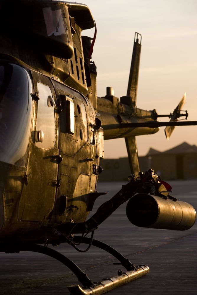 An OH-58D Kiowa during sunset Canvas Art - Terry MooreStocktrek Images (23 x 35)