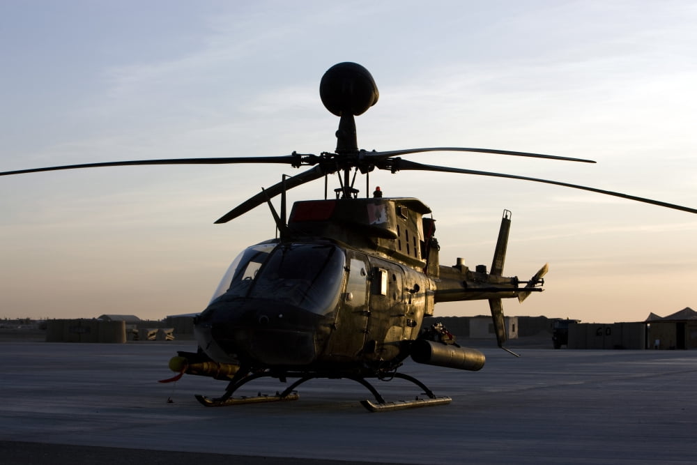 An OH-58D Kiowa during sunset Canvas Art - Terry MooreStocktrek Images (35 x 23)