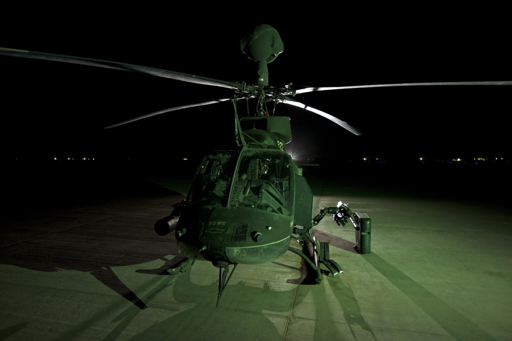 An OH-58D Kiowa helicopter at COB Speicher Tikrit Iraq Canvas Art - Terry MooreStocktrek Images (18 x 12)