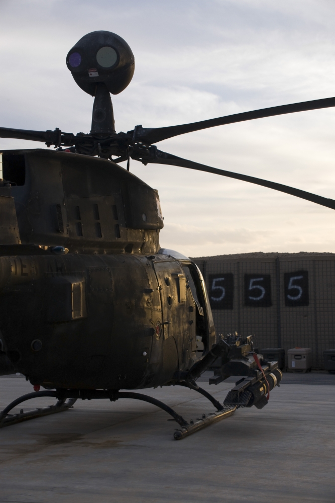An OH-58D Kiowa helicopter during sunset Canvas Art - Terry MooreStocktrek Images (12 x 18)
