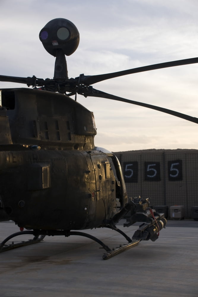 An OH-58D Kiowa helicopter during sunset Canvas Art - Terry MooreStocktrek Images (23 x 35)