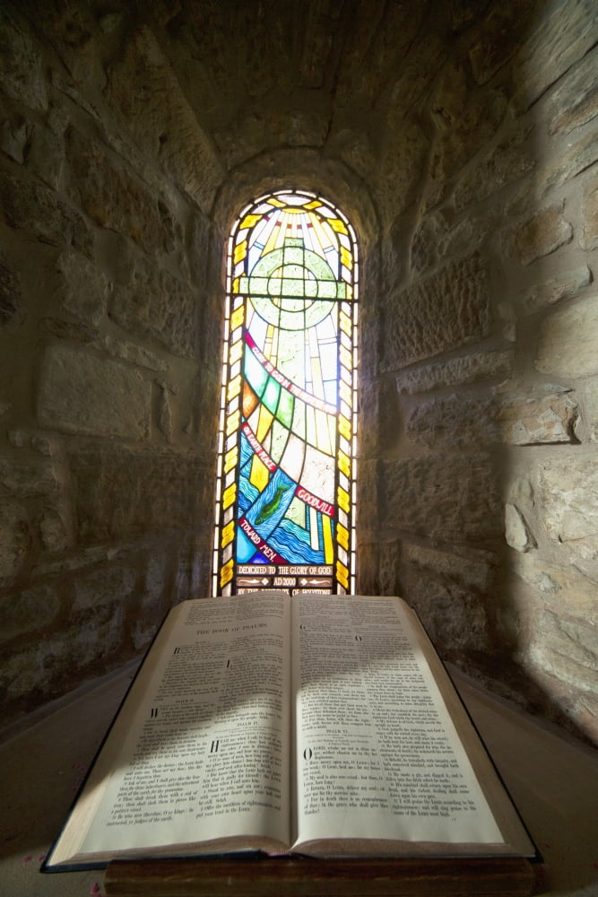 An Open Bible And A Stained Glass Window In St Marys Church Holystone Northumberland England Canvas Art - John Short Design Pics (24 x 38)