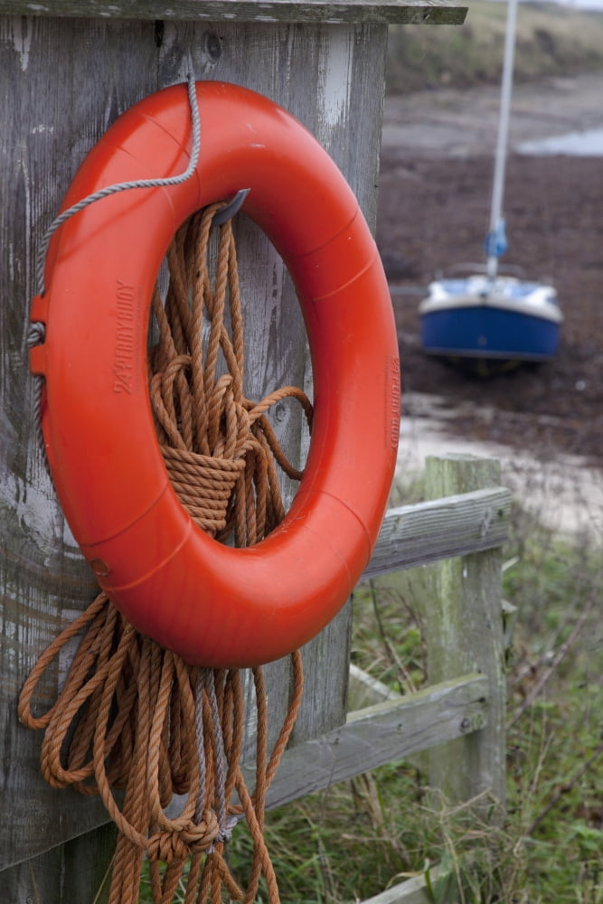 An Orange Life Preserver Ring And Rope Hanging On A Wooden Shed Wall Northumberland England Canvas Art - John Short Design Pics (12 x 19)