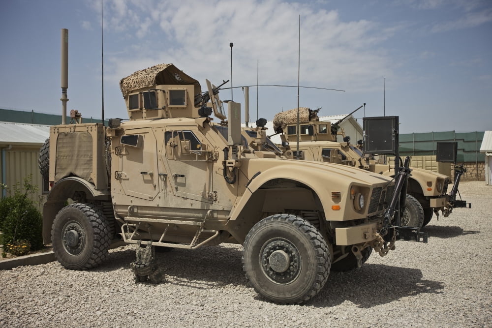 An Oshkosh M-ATV parked at a military base in Afghanistan Canvas Art - Terry MooreStocktrek Images (18 x 12)