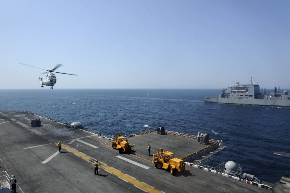 An SA330J Puma helicopter conducts vertical replenishement Canvas Art - Stocktrek Images (35 x 23)